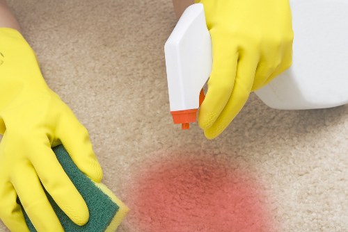 Technician preparing safe carpet cleaning equipment indoors